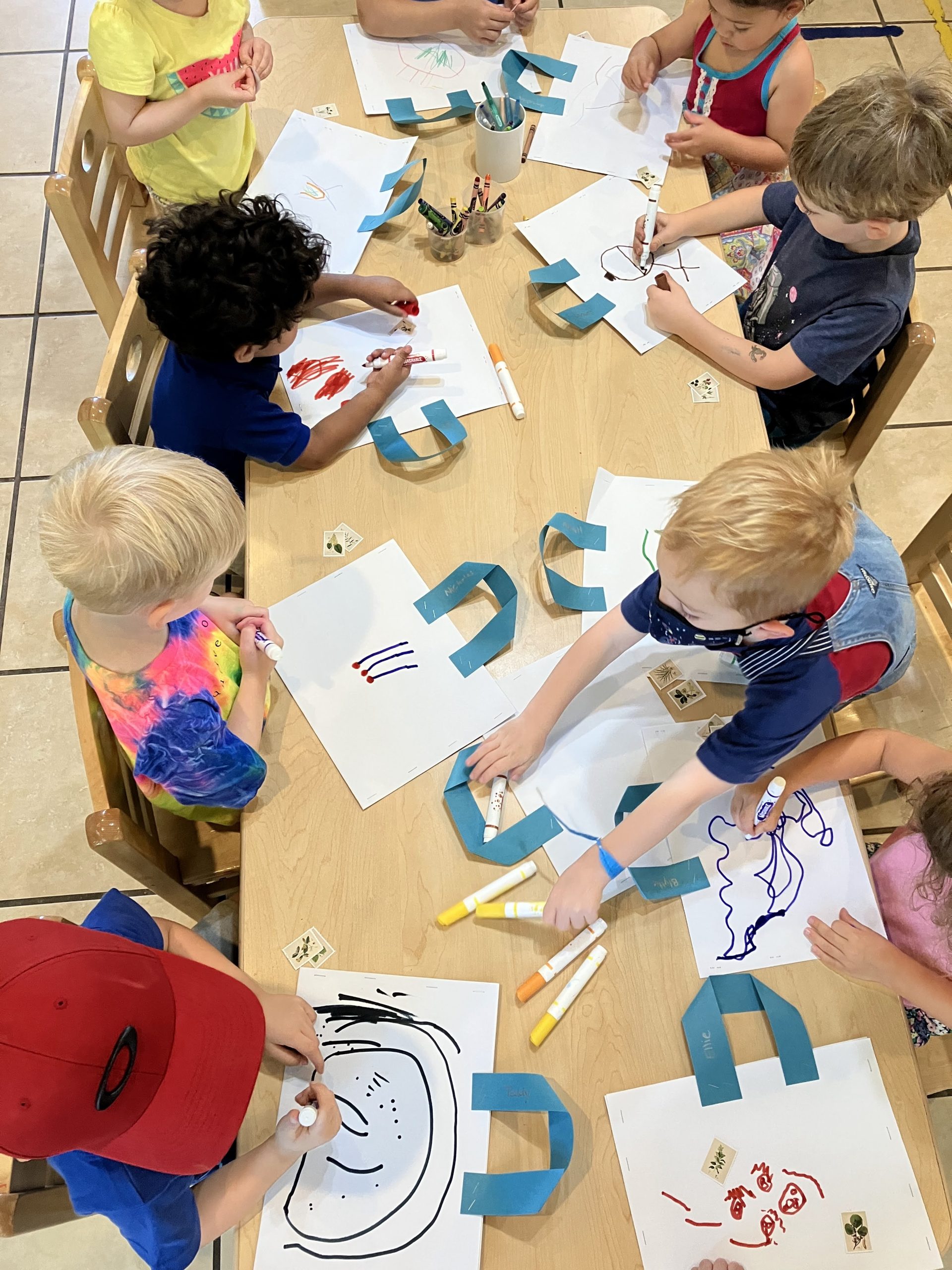 Children engaging in creative activities in the vibrant learning environment.