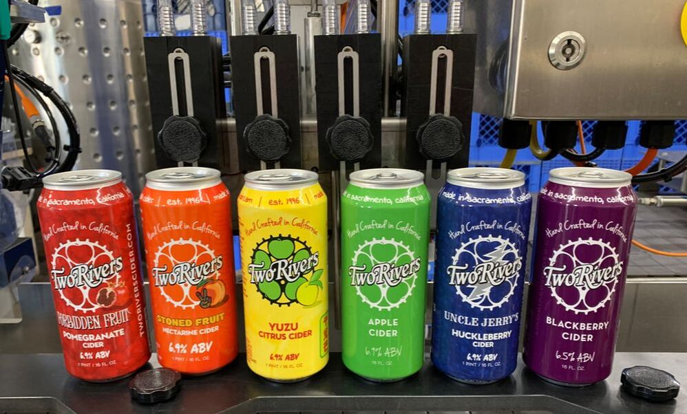 Patrons enjoying pints at Two Rivers Cider Bar — a cozy East Sacramento neighborhood spot.